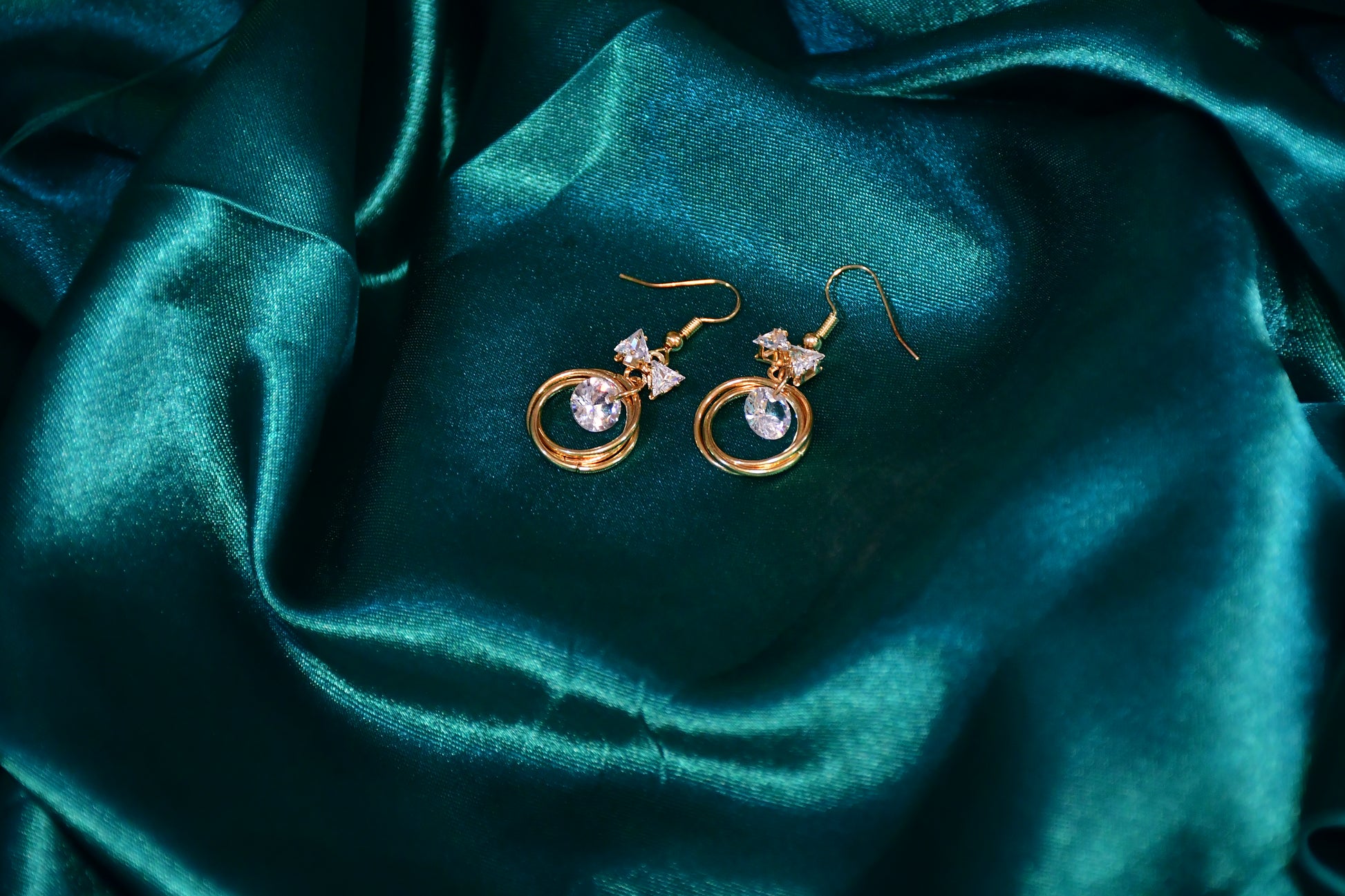 Halo Twist Golden Finish Earrings