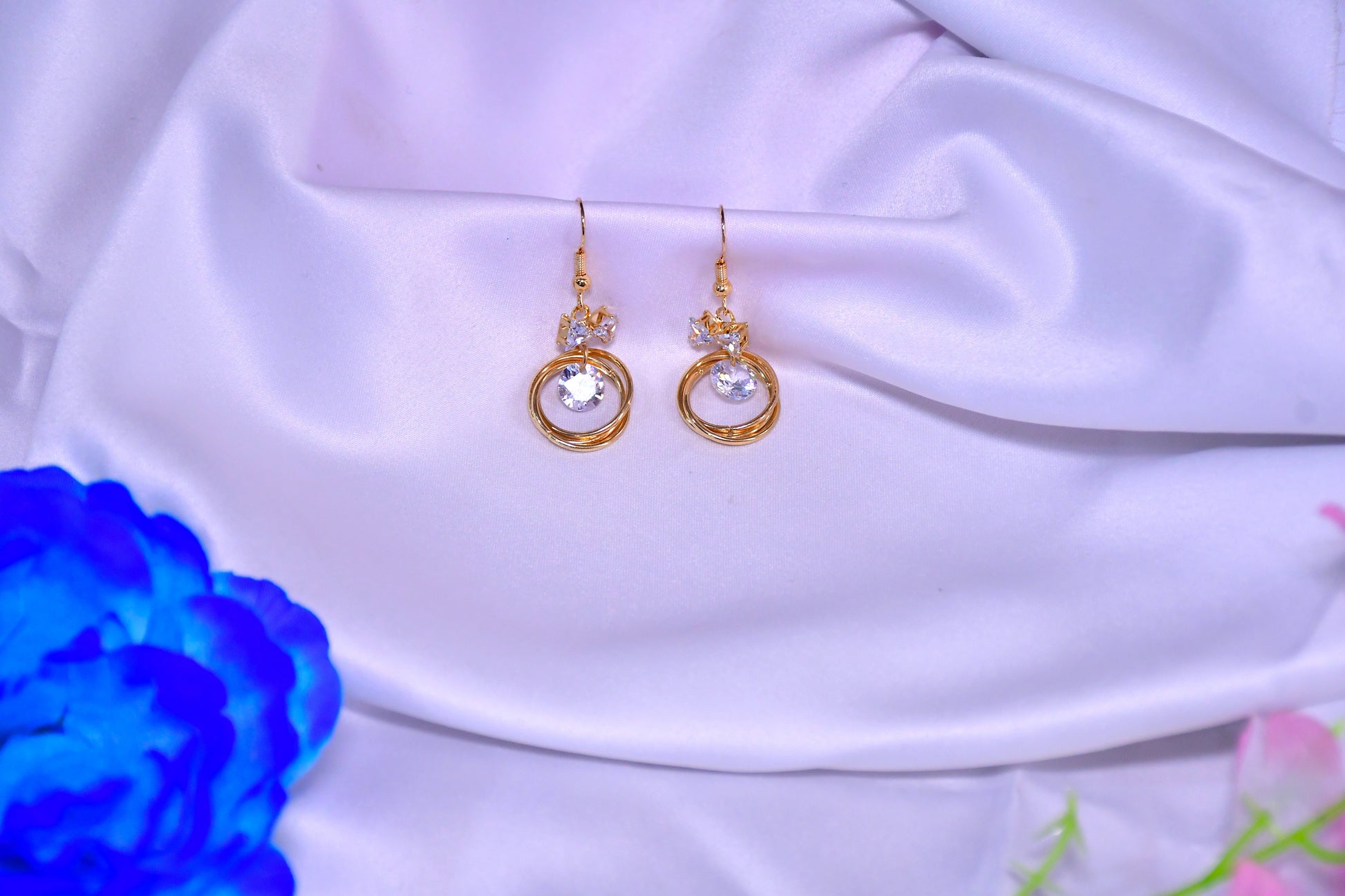 Halo Twist Golden Finish Earrings
