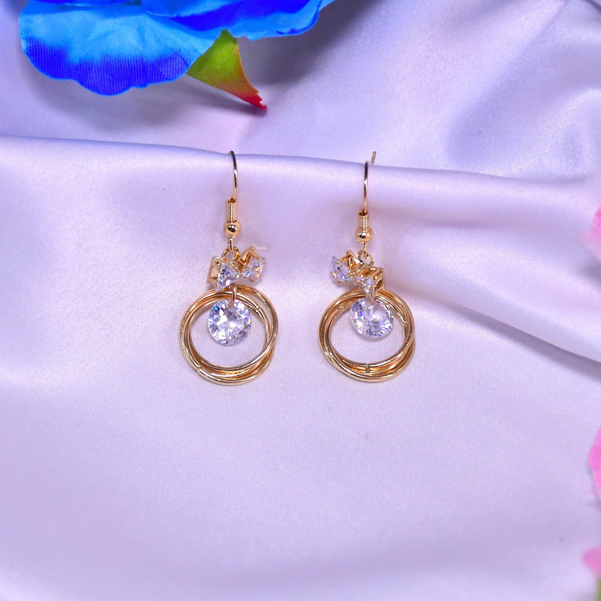 Halo Twist Golden Finish Earrings